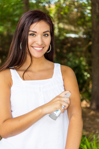 woman_with_bug_repellant Woman using natural bug spray
